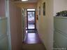 Hallway featuring baseboards