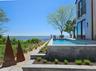 Outdoor pool featuring a water view