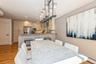 Dining room with recessed lighting, baseboard heating, light wood-type flooring, and a wall unit AC