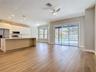 bright open-concept layout with new vinyl flooring, a fully renovated kitchen
