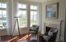 Living room with high ceilings & Marble fireplace... gleaming Mahogany hardwood floors throughout...