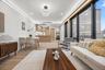 Living room featuring light wood finished floors, recessed lighting, and electric panel