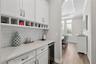 This bar area is conveniently located between the kitchen and formal dining room.