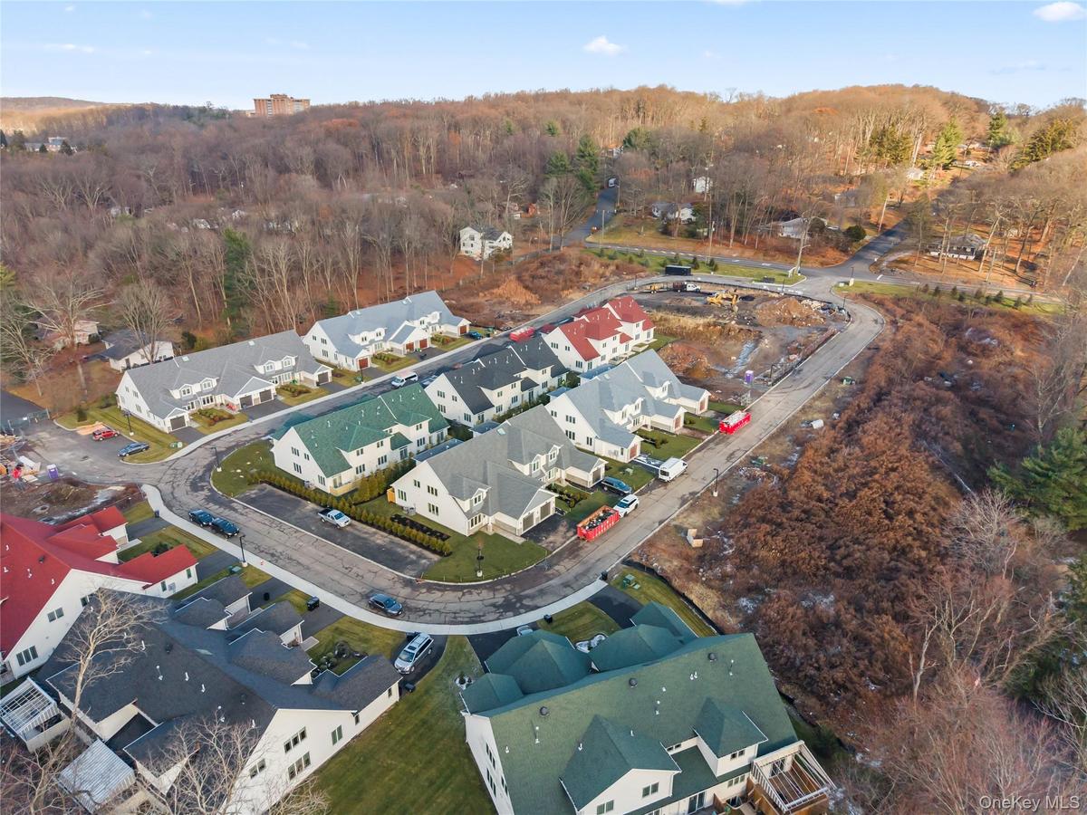 View of property location with nearby suburban area