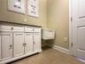 The door of this laundry room leads back to the bonus area.
