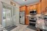Second Kitchen has a sliding door to the rear lanai and also a door leading directly into the home.