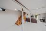 Finished below grade area with stairs and light tile patterned floors