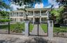 Wrought Iron fence surrounding the front lawn.