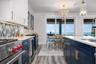 Kitchen and dining with expansive views of Tampa Bay and Skyway Bridge