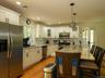 Plenty of room at the counter as family and friends gather to find out what's cooking in the kitchen.