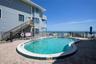 Take a dip in the pool and watch the kids from your unit!