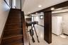 Staircase with wood-finish treads and risers