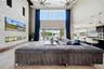 The family room has stunning lake views with an electric fireplace with built in 85 TV