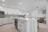 Breakfast bar island with wet bar and beverage fridge