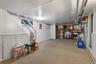 Finished basement with stairway and carpet floors