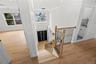 Grand Entry with 2 coat closets, custom woodwork front door header, chandelier lowering mechanism for easy cleaning!