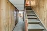 Garage door to the left. Basement steps lead into first floor unit.