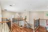 Showcasing the beautiful custom railings on the 2nd level with 10' ceilings.
