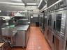 Kitchen with stainless steel refrigerator and stainless steel counters