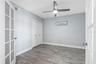 ... Main Floor Guest Bedroom #2 .. New Tile Floors - Closet and French Doors ..