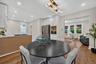 Open concept kitchen and dining area featuring recessed lighting and wood-finish flooring