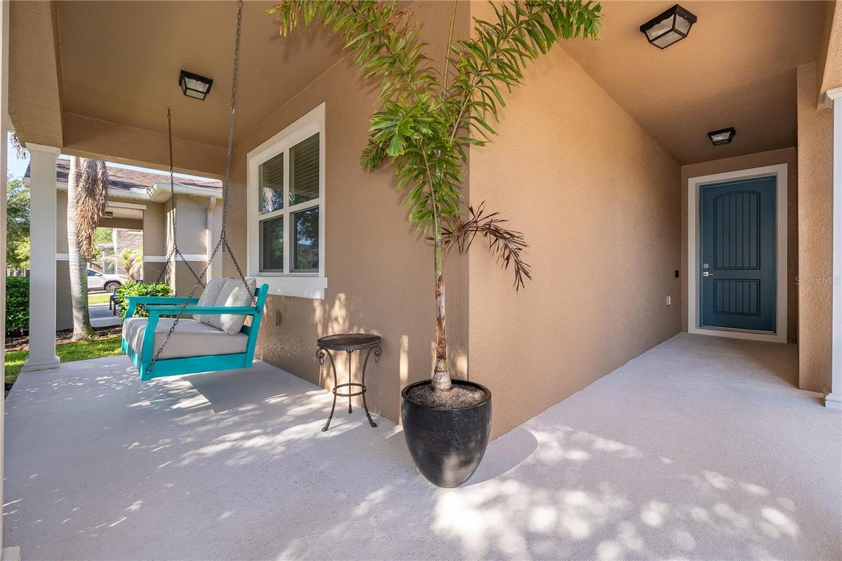 Charming curb appeal, porch swing pond and preserve views and no front neighbors