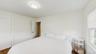 Bedroom with dark wood finished floors