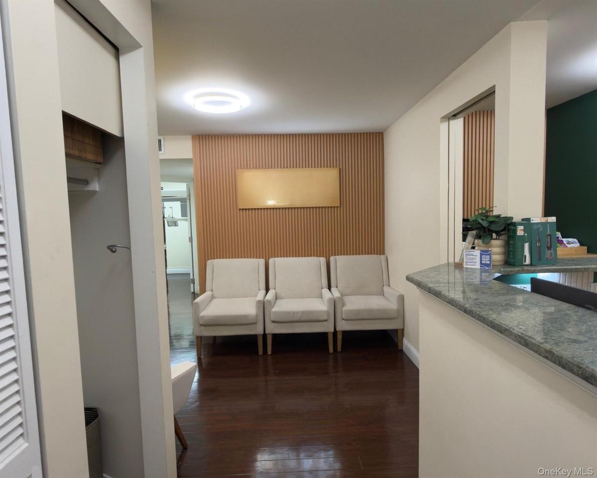 Hall featuring dark wood-type flooring