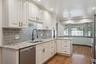 Remodeled Kitchen with Granite Countertops and Stainless Steel Appliances