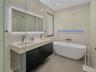 Full bathroom on first floor with double vanity, shower and soaking tub and separate shower