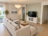 14048 Larkspur Lake Dr -Open-concept living room with a light, airy luxe coastal feel. Virtually staged.