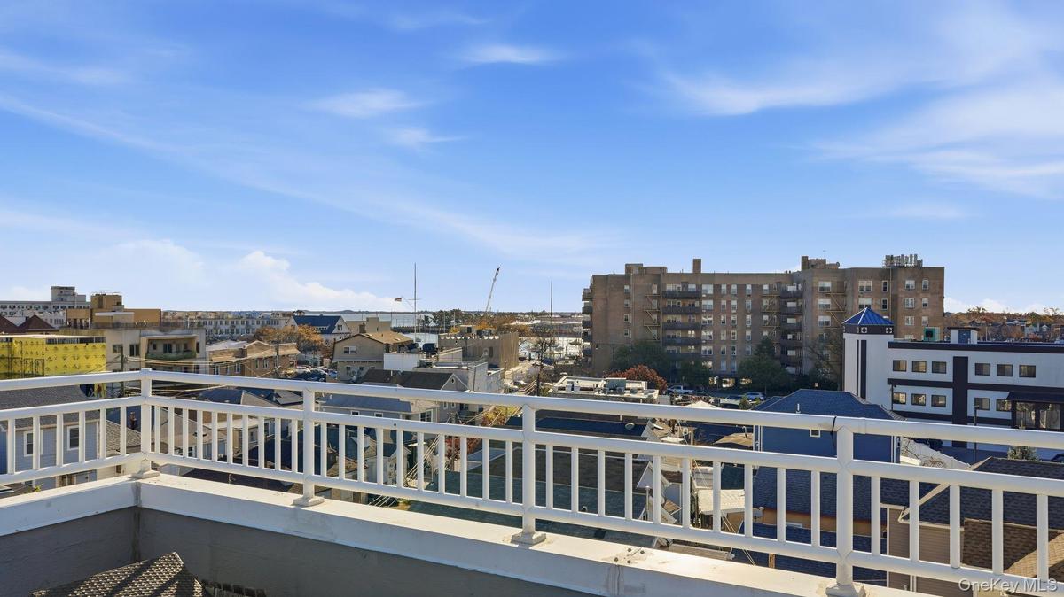Balcony featuring a view of city