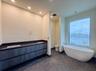 (as of April 8, 2026) the primary bath includes a double vanity, an oversized shower, and freestanding tub, both controlled with Kohler's Anthem Digit