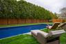 View of pool featuring a fenced backyard and a patio