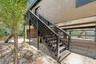 Balcony and stairs leading to 2nd floor