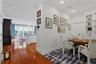 View from the den/office showcasing the homes open-concept layout and seamless flow to the kitchen and living room