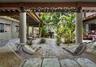 The zen courtyard with fountain is inspiring for relaxing or leading to the waterfront just beyond.