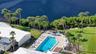 Aerial view of the beautiful clubhouse pool on the lagoon.