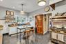 Kitchen with white cabinetry, decorative backsplash, pendant lighting, gas stove, and recessed lighting
