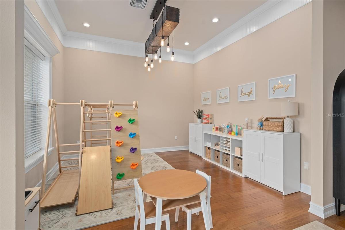 Original photo dining room space currently set up as playroom.