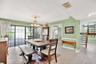The formal dining room leads to an outdoor courtyard and fountain.