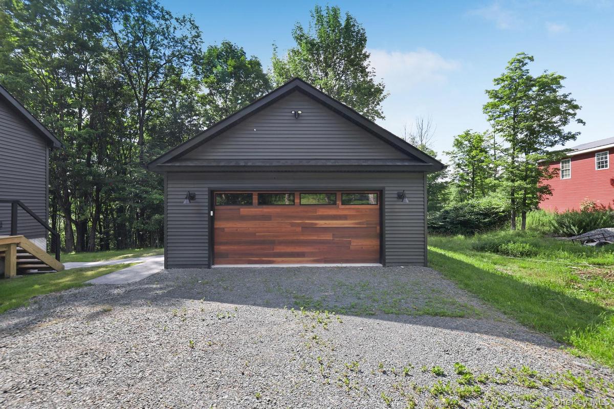 Two car garage from with walkway to the home.