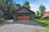 Two car garage from with walkway to the home.