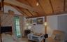Vaulted wood-paneled ceiling with exposed beams