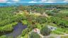 Welcome to 1788 Patricia Ave Dunedin and your lakefront sanctuary with the beach being this far away