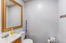 Half bathroom with toilet and vanity