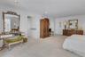 Primary Bedroom with two walk in closets and a linen closet.