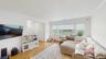 Living room featuring baseboards, ornamental molding, light wood-style floors, recessed lighting, and radiator