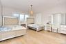 Bedroom with light wood finished floors