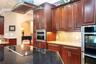 Custom Kitchen: Prep Sink, Snackbar, Custom Cabinets with under and over lighting, Hybrid Induction Cooktop, Hidden walk-in pantry
